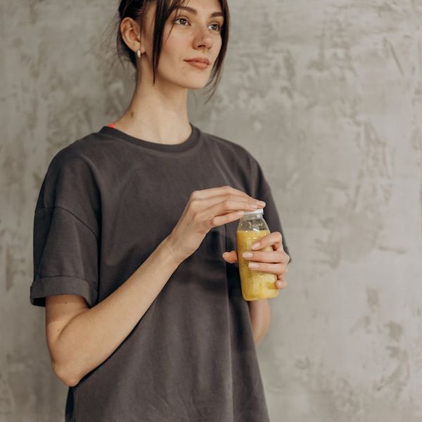Smiling person in comfortable sportswear after a workout, looking refreshed.